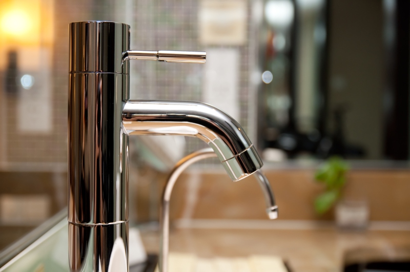 Leaking tap being repaired in Brent Cross